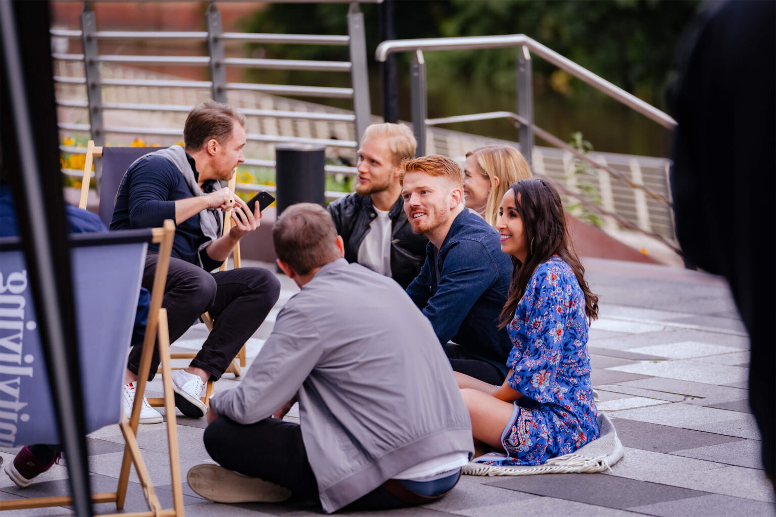 Group of friends at a resident event outside with deck chairs